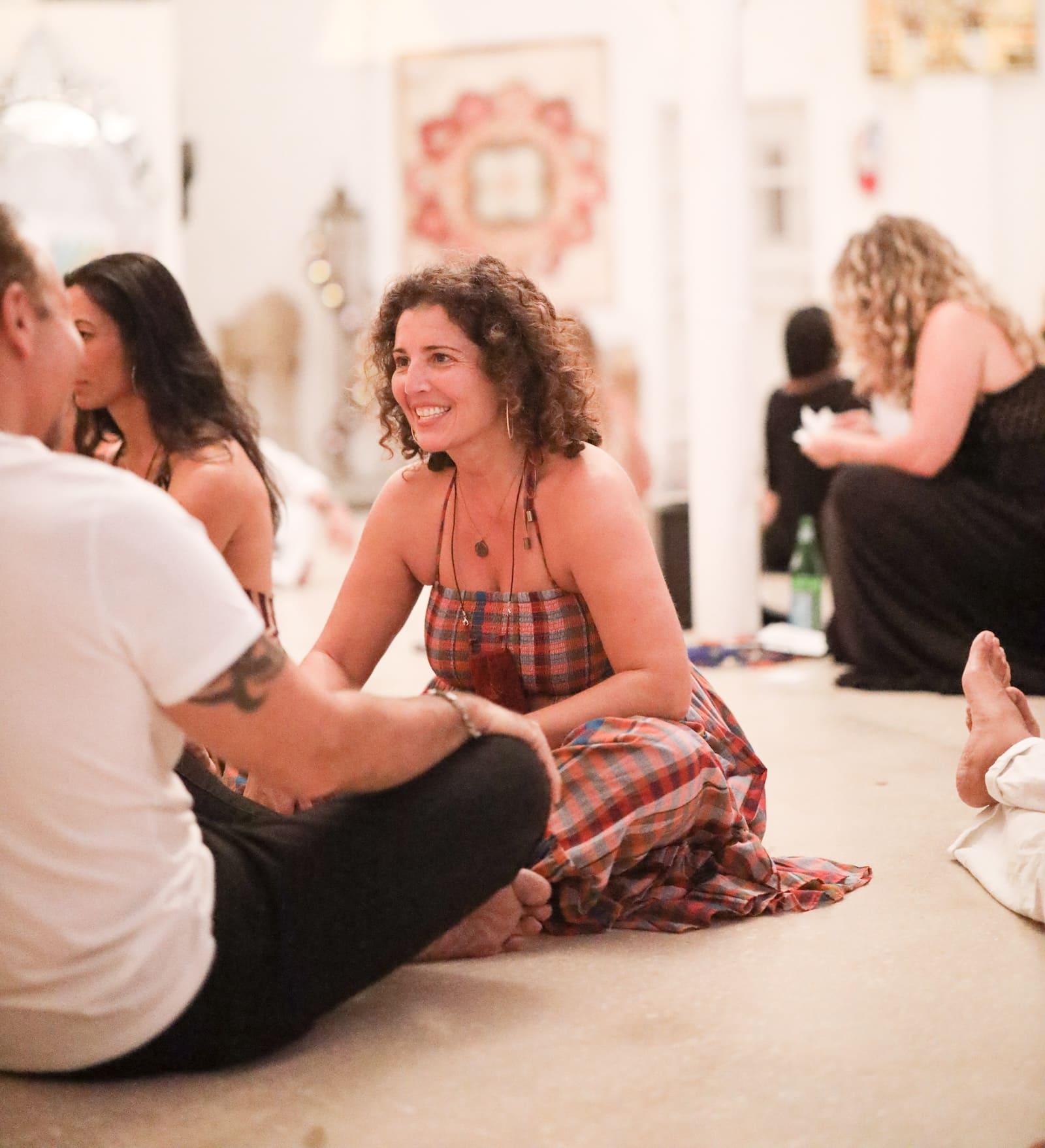 Singles participating in a guided connection exercise during a Tantra Speed Date event.